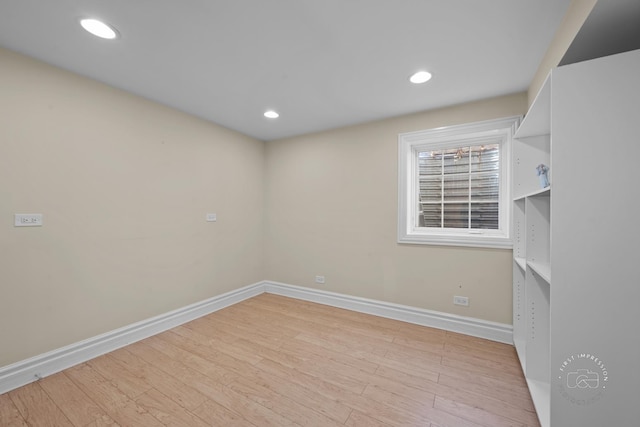 unfurnished room featuring light wood-type flooring, baseboards, and recessed lighting