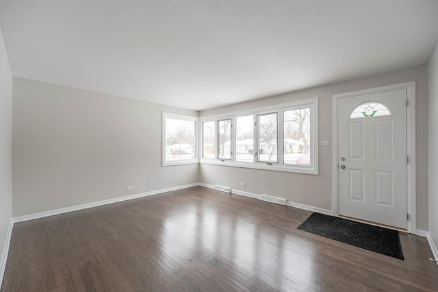 entrance foyer with dark hardwood / wood-style floors