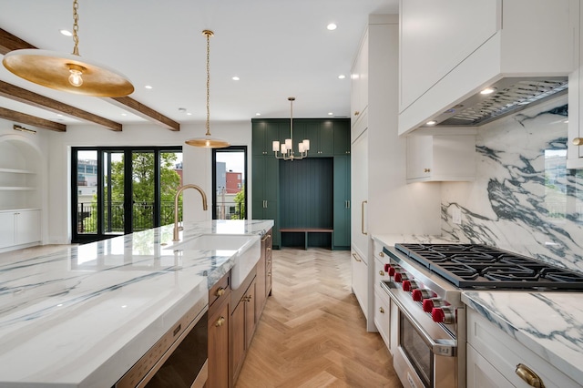 kitchen featuring recessed lighting, custom range hood, high end stainless steel range oven, decorative backsplash, and a sink