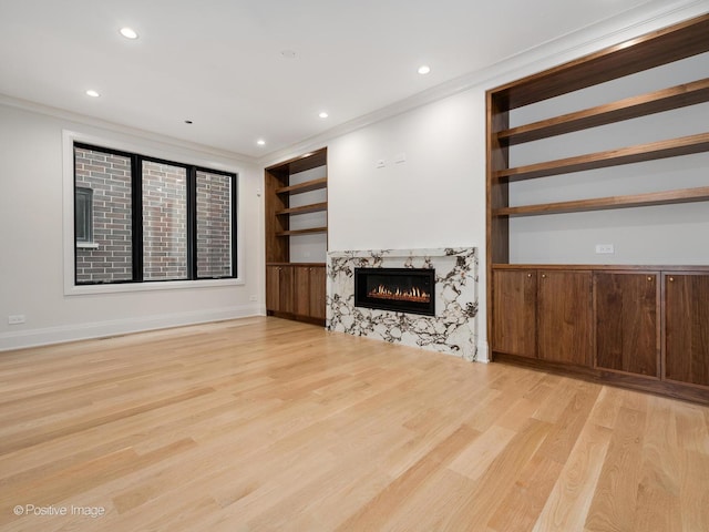 1208 W Wellington St Unit 1F, Chicago, IL 60657 - unfurnished living room with ornamental molding, light wood finished floors, and built in features