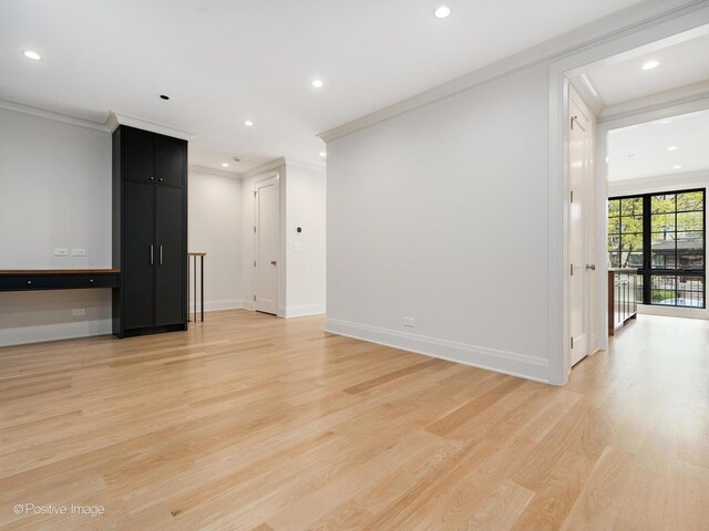 1208 W Wellington St Unit 1F, Chicago, IL 60657 - empty room featuring crown molding, recessed lighting, baseboards, and light wood-style floors