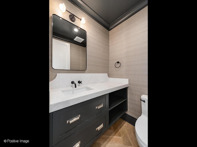 1208 W Wellington St Unit 1F, Chicago, IL 60657 - half bathroom featuring vanity, wallpapered walls, and toilet