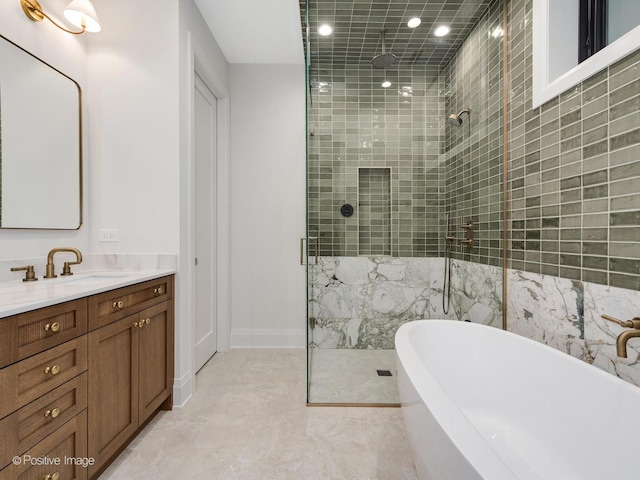 1208 W Wellington St Unit 1F, Chicago, IL 60657 - bathroom featuring vanity, recessed lighting, a freestanding bath, and a stall shower