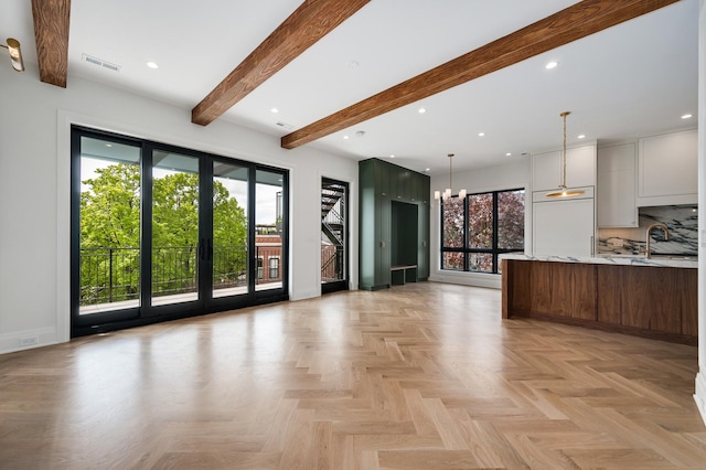 interior space featuring plenty of natural light, visible vents, beamed ceiling, and recessed lighting