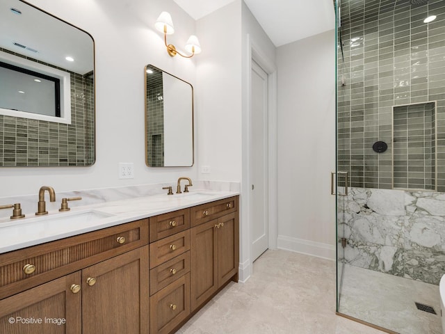 1208 W Wellington St Unit 1F, Chicago, IL 60657 - bathroom featuring baseboards, visible vents, a tile shower, and a sink