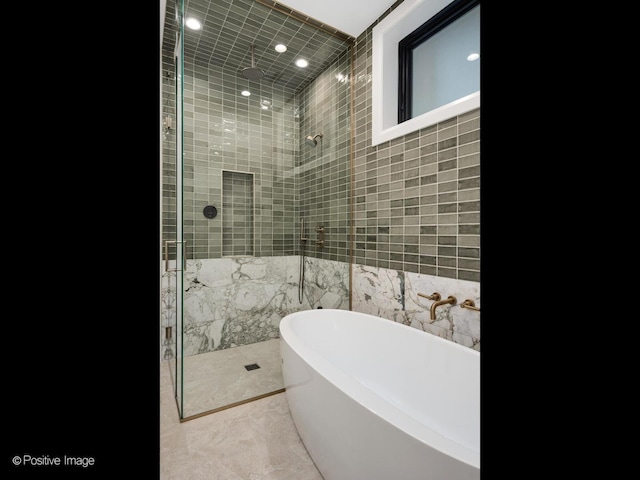 1208 W Wellington St Unit 1F, Chicago, IL 60657 - full bath featuring recessed lighting, a freestanding bath, a shower stall, and tile walls