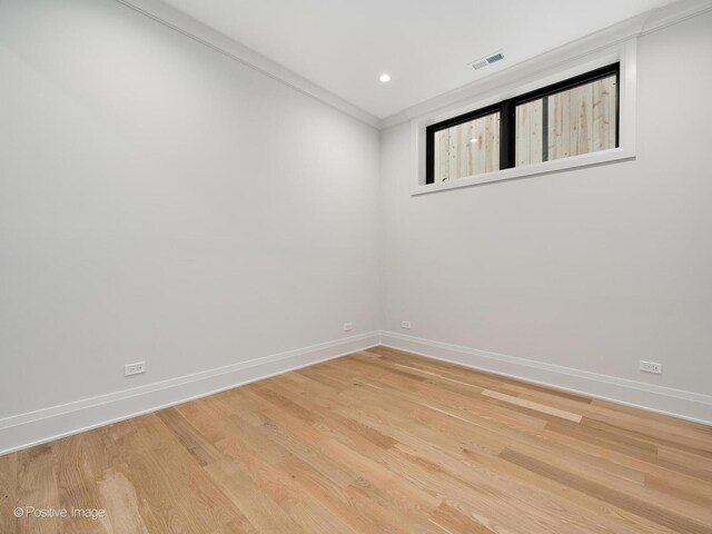 1208 W Wellington St Unit 1F, Chicago, IL 60657 - unfurnished room with baseboards and light wood-style floors
