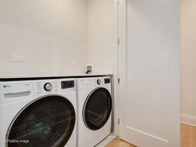 1208 W Wellington St Unit 1F, Chicago, IL 60657 - laundry area featuring laundry area, washing machine and dryer, and light wood finished floors