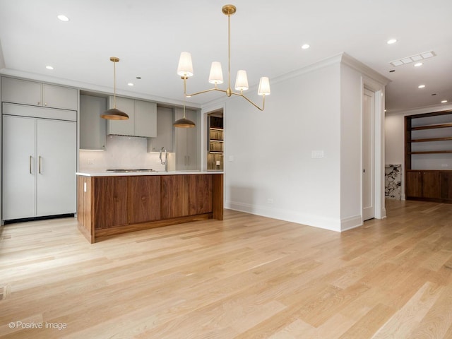 1208 W Wellington St Unit 1F, Chicago, IL 60657 - kitchen featuring visible vents, light countertops, light wood-style flooring, recessed lighting, and gray cabinetry