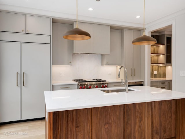 1208 W Wellington St Unit 1F, Chicago, IL 60657 - kitchen featuring a sink, decorative backsplash, and gray cabinetry