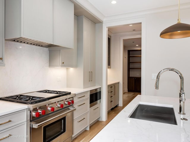 1208 W Wellington St Unit 1F, Chicago, IL 60657 - kitchen featuring decorative backsplash, ventilation hood, designer range, light stone counters, and a sink