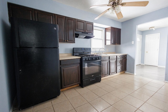 kitchen featuring black appliances, dark brown cabinets, and light tile patterned floors