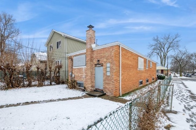 view of snow covered property