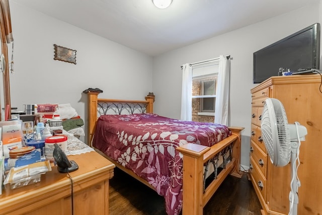 bedroom featuring dark hardwood / wood-style flooring