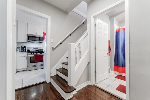 stairs with tile patterned flooring