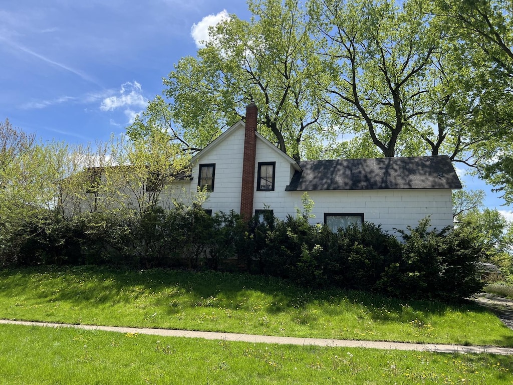 view of property exterior featuring a yard