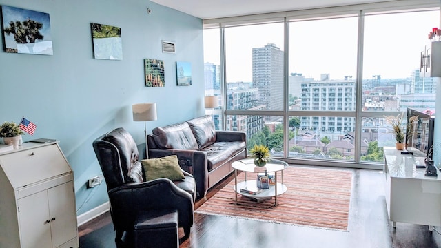 living room featuring floor to ceiling windows