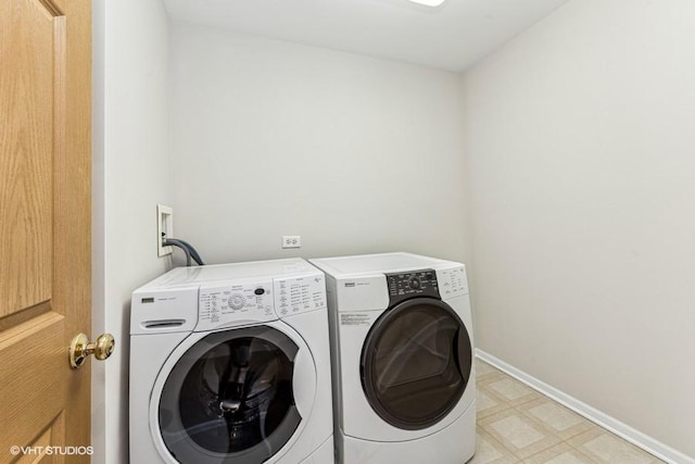 clothes washing area with independent washer and dryer