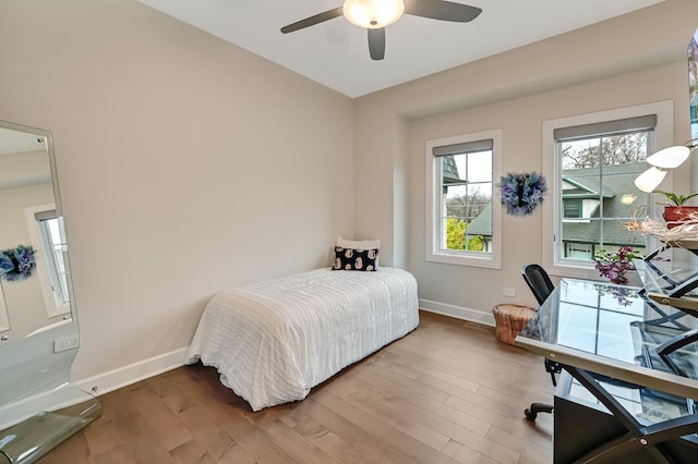 bedroom featuring ceiling fan and hardwood / wood-style flooring