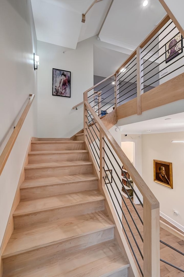 stairway featuring hardwood / wood-style flooring