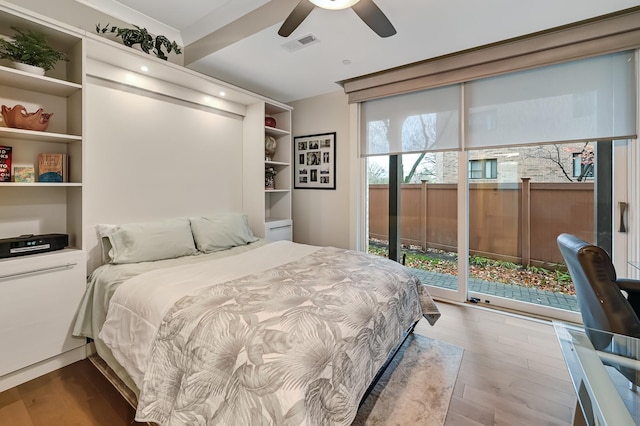 bedroom featuring access to exterior, hardwood / wood-style flooring, and ceiling fan