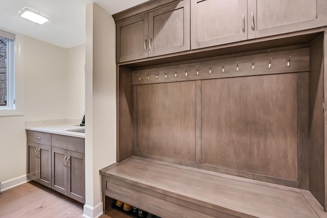 mudroom with light hardwood / wood-style flooring