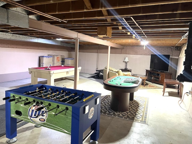 playroom with concrete flooring and pool table