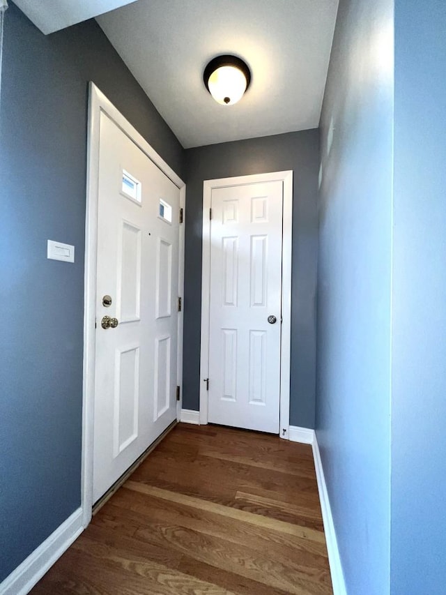 doorway to outside with dark hardwood / wood-style flooring