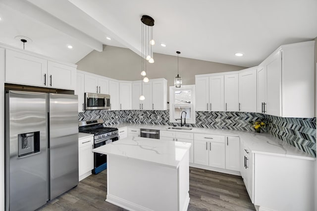 kitchen featuring backsplash, stainless steel appliances, sink, lofted ceiling with beams, and a center island