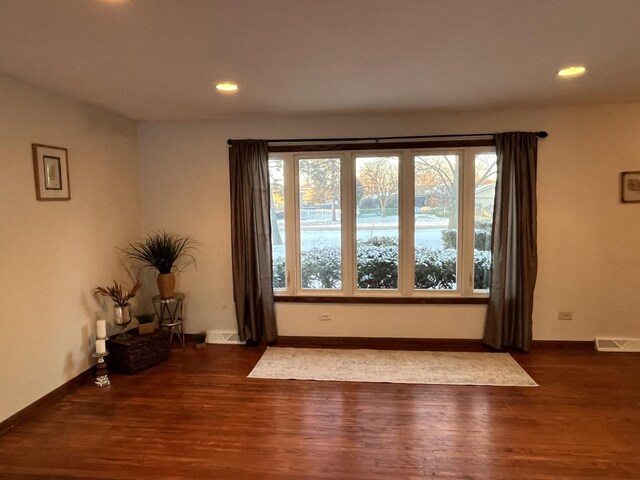 view of front of home with a front yard and a garage