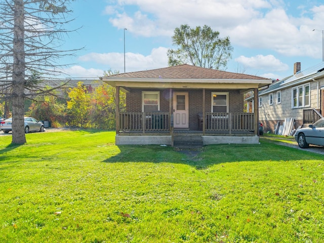 bungalow featuring a porch and a front yard