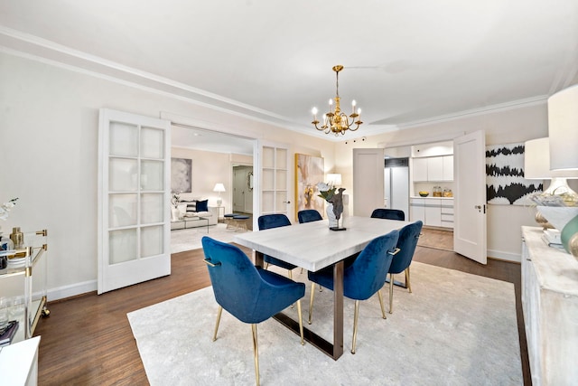 dining space with ornamental molding, french doors, wood finished floors, and a notable chandelier