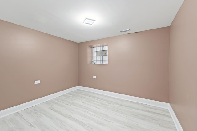 spare room featuring light wood-type flooring