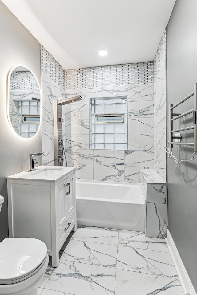 full bathroom with vanity, toilet, and tiled shower / bath combo