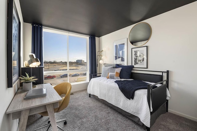 bedroom featuring carpet flooring and multiple windows