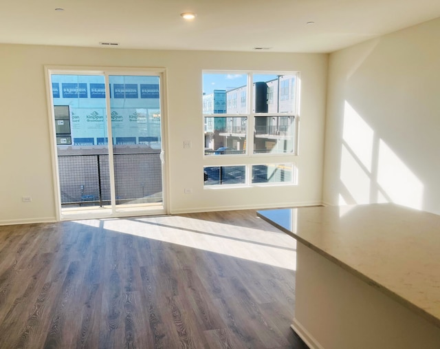 doorway with hardwood / wood-style flooring