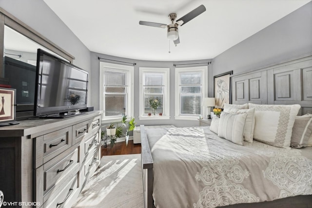 bedroom featuring ceiling fan and dark hardwood / wood-style floors