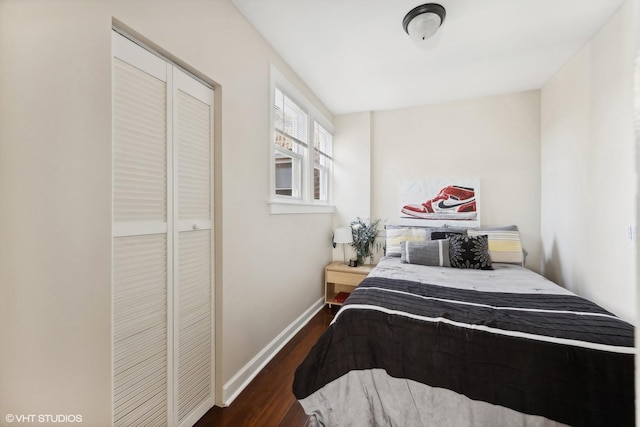 bedroom with a closet and dark wood-type flooring