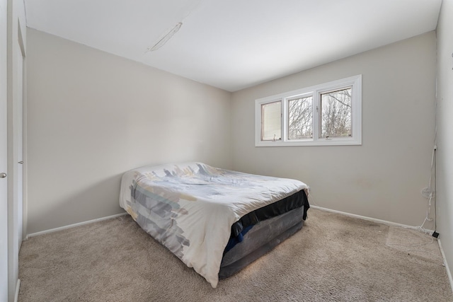 bedroom featuring light carpet