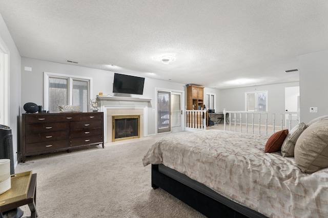 carpeted bedroom with a textured ceiling