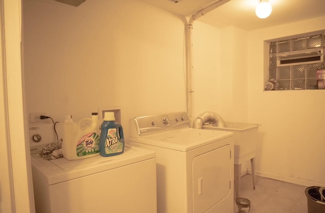 washroom with light tile patterned flooring and separate washer and dryer