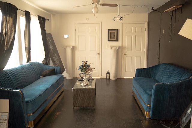 living room featuring ceiling fan and dark wood-type flooring