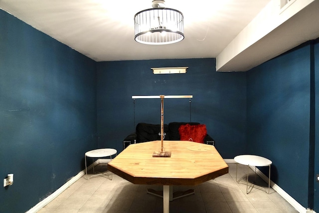 dining area featuring tile patterned flooring