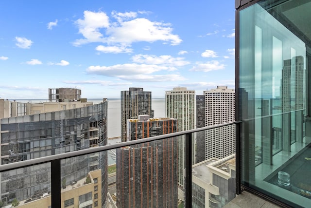 balcony featuring a water view