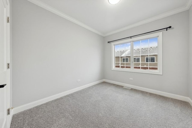 empty room with crown molding and carpet