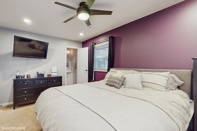 carpeted bedroom featuring ensuite bathroom and ceiling fan