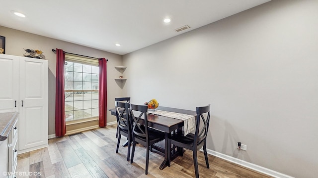 dining space with light wood-type flooring