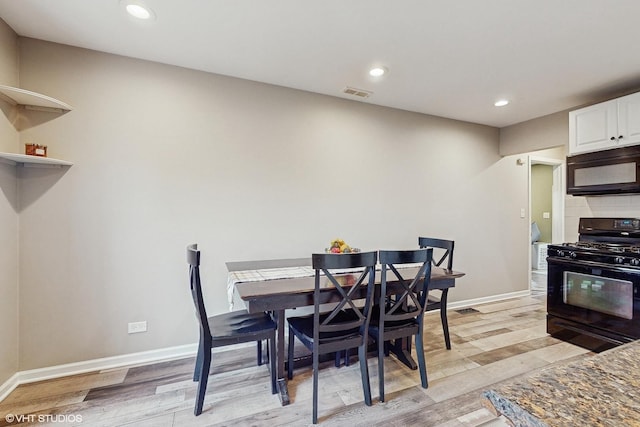 dining space featuring light hardwood / wood-style floors