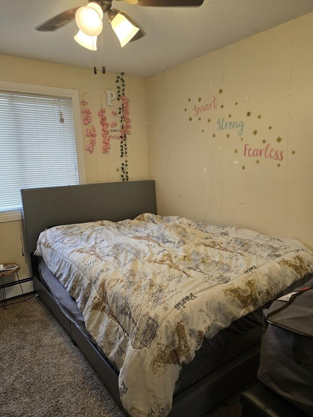 bedroom with carpet flooring, ceiling fan, and a baseboard heating unit