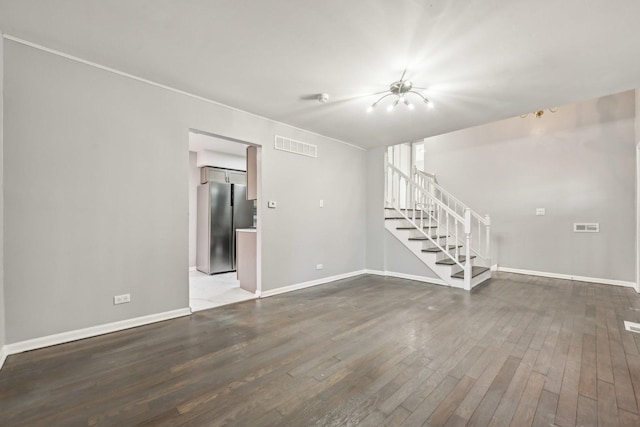 spare room featuring wood-type flooring